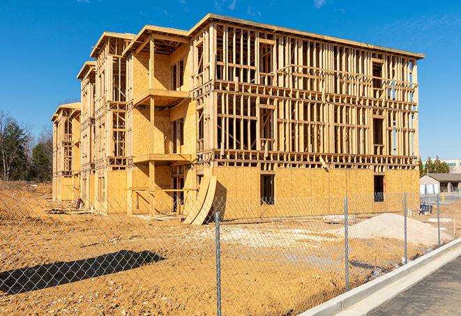 a close-up of temporary chain link fences enclosing a job site, signaling progress in the project's development in Ridge Spring